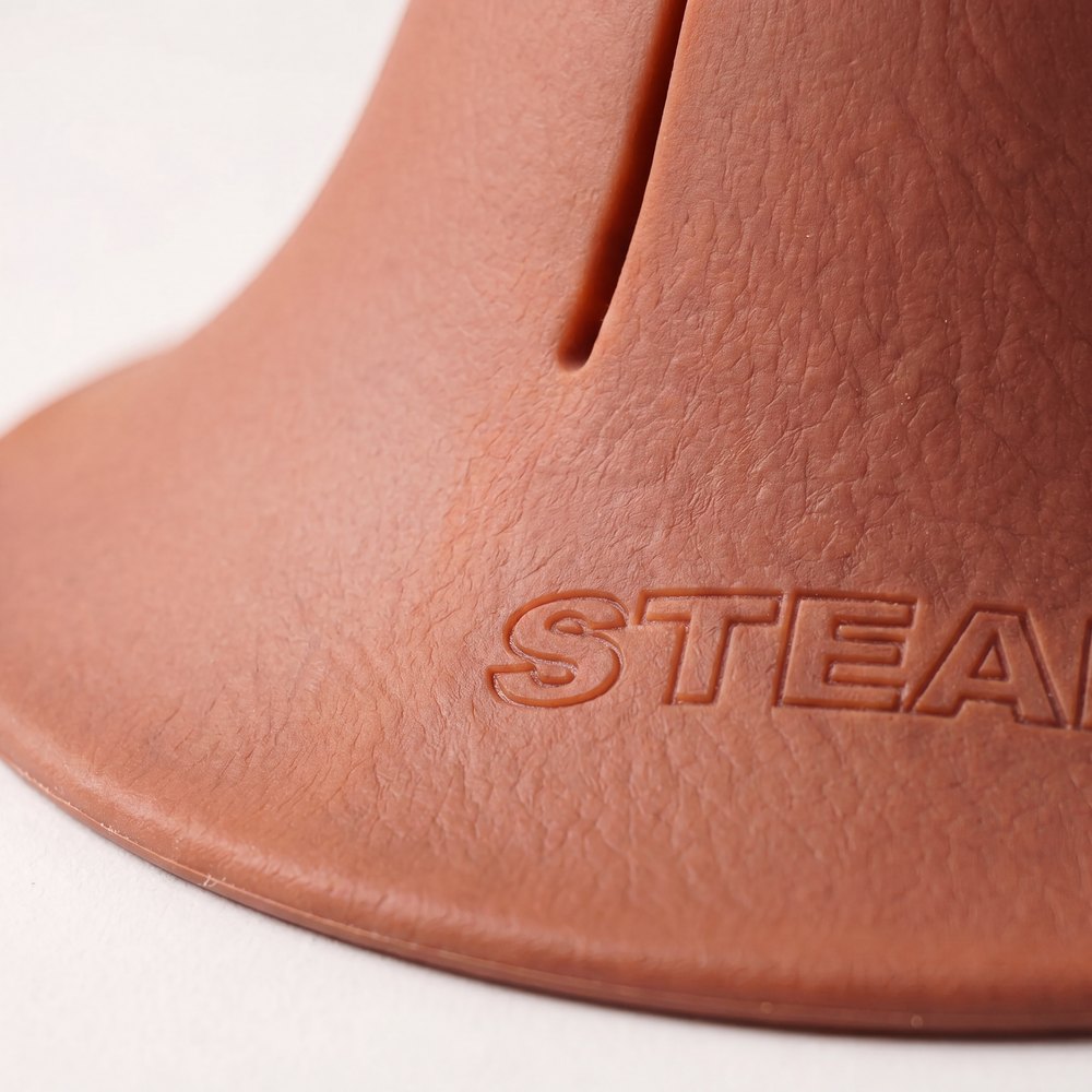 A macro photograph of the flared base of a Steadi, showing the moulded STEADI mark.
